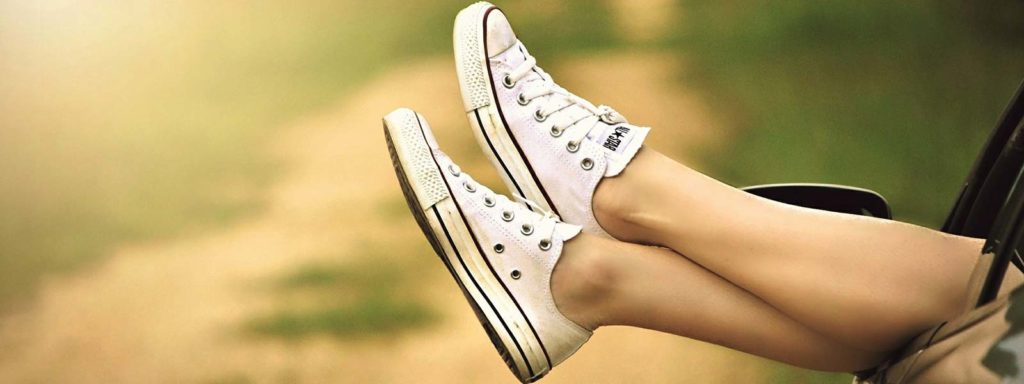 Feet sticking out of car window