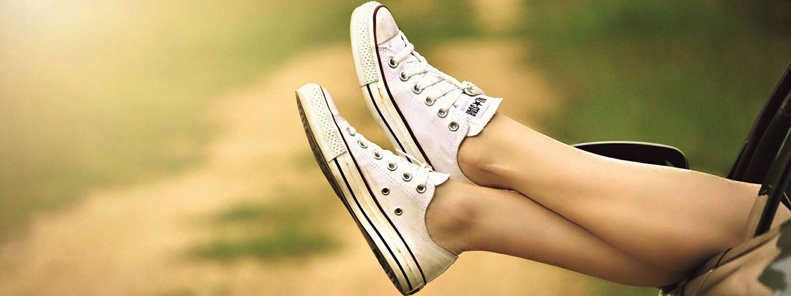 Feet sticking out of car window